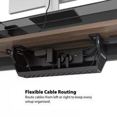 Under-desk cable management box showing flexible cable routing with a power strip and cables neatly organised beneath a desk