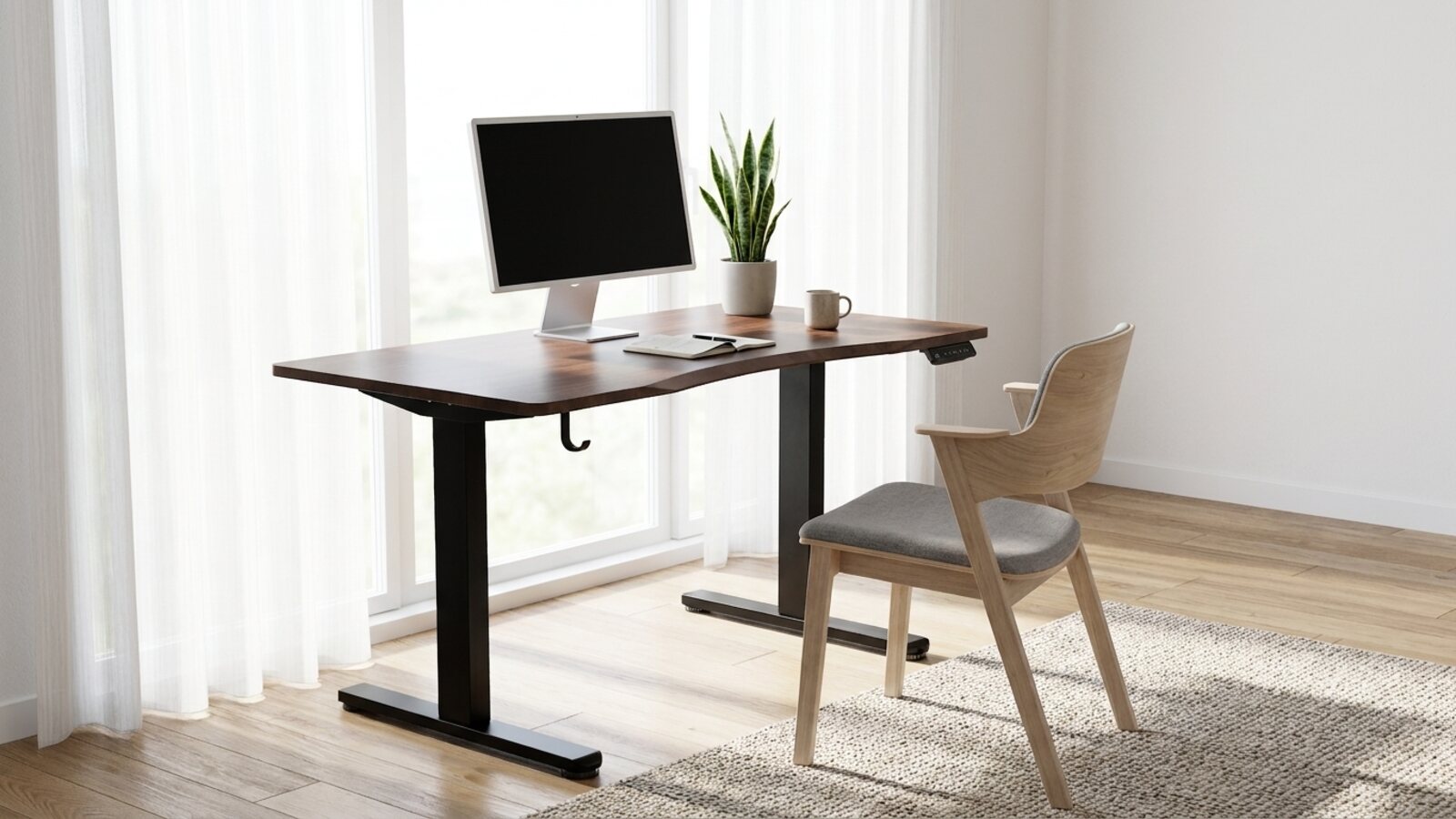 The Vival Desk in a bright, minimalist Singapore home workspace, with a laptop and a light chair beside a window