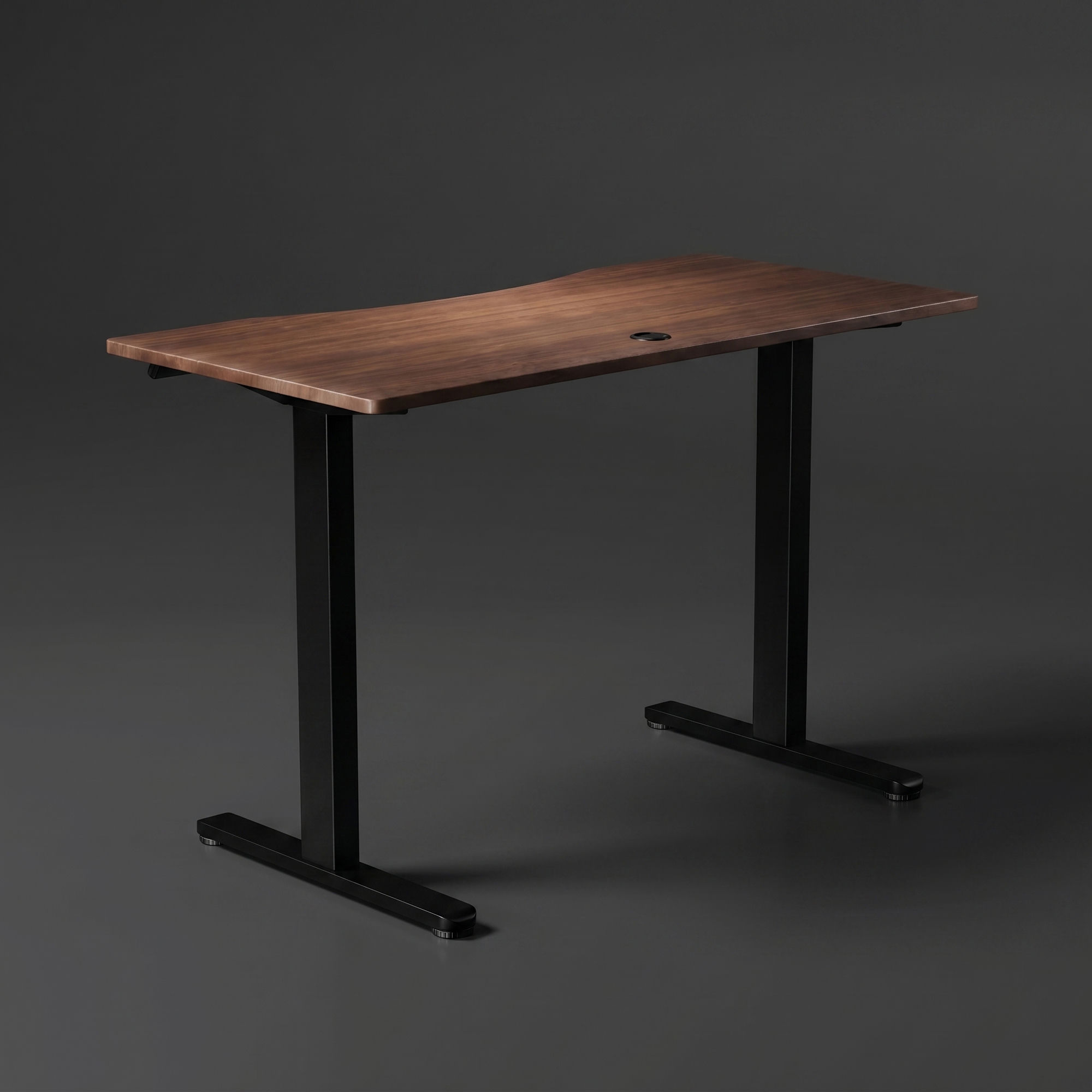 Top view of the Vival Desk walnut surface with a cable grommet